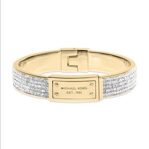 Michael Kors gold tone hinge plaque bracelet.